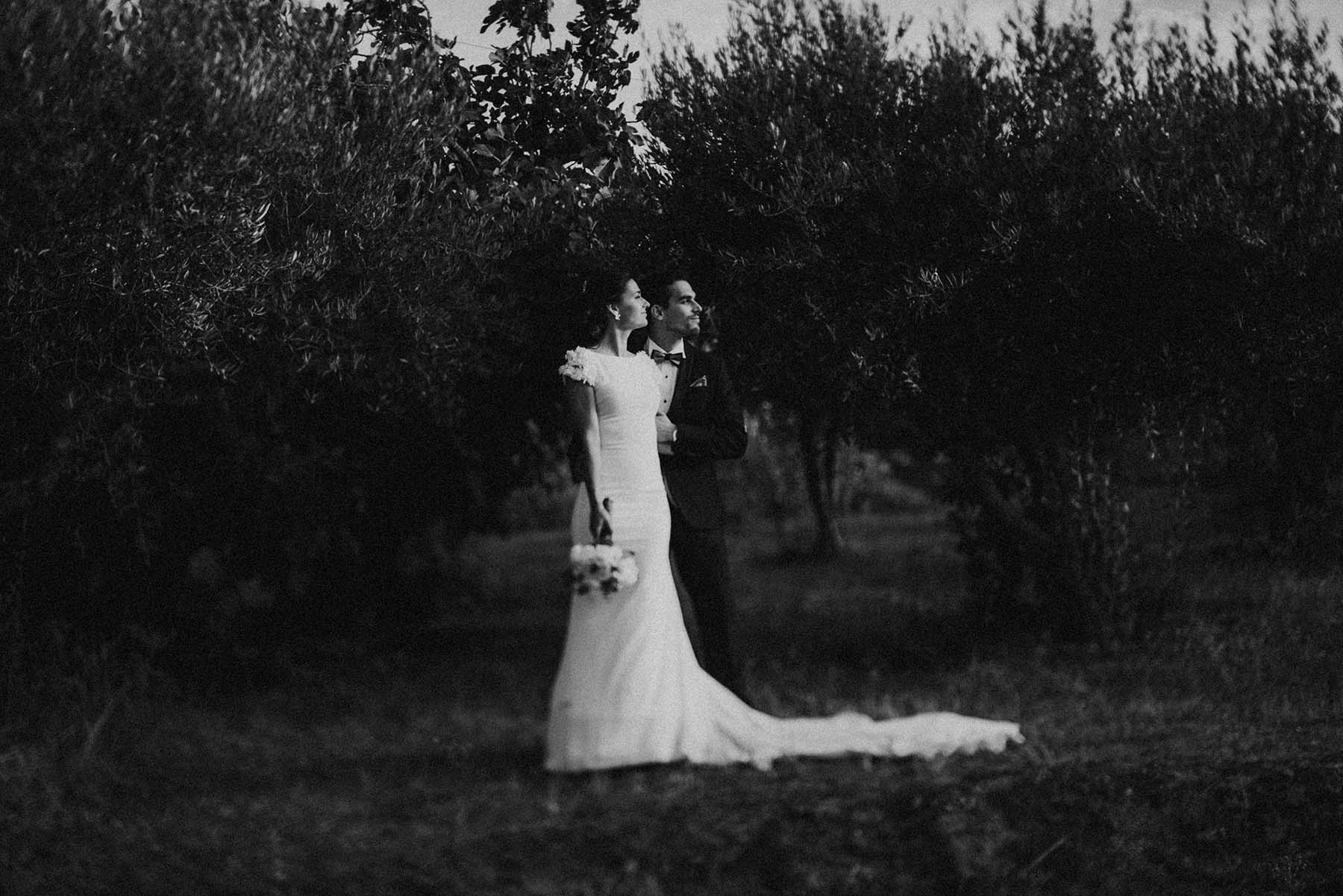 black and white photo of a couple looking to the sun