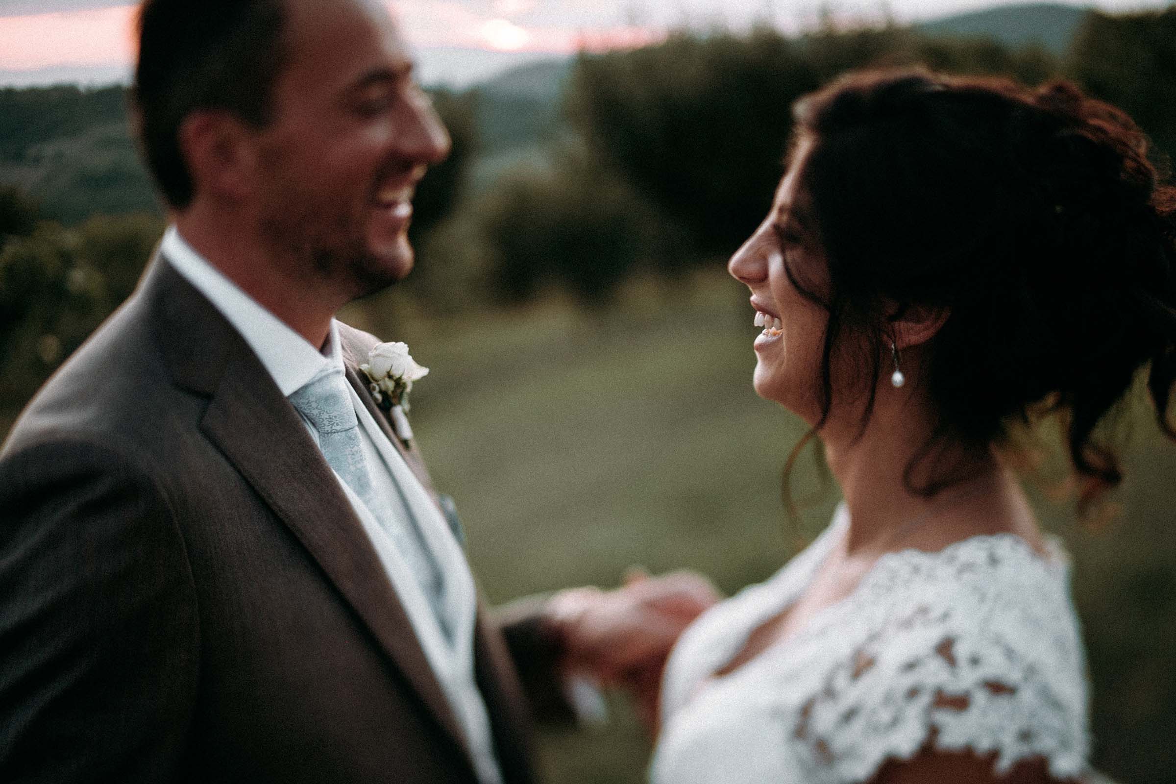 wedding couple laughing in love out of focus