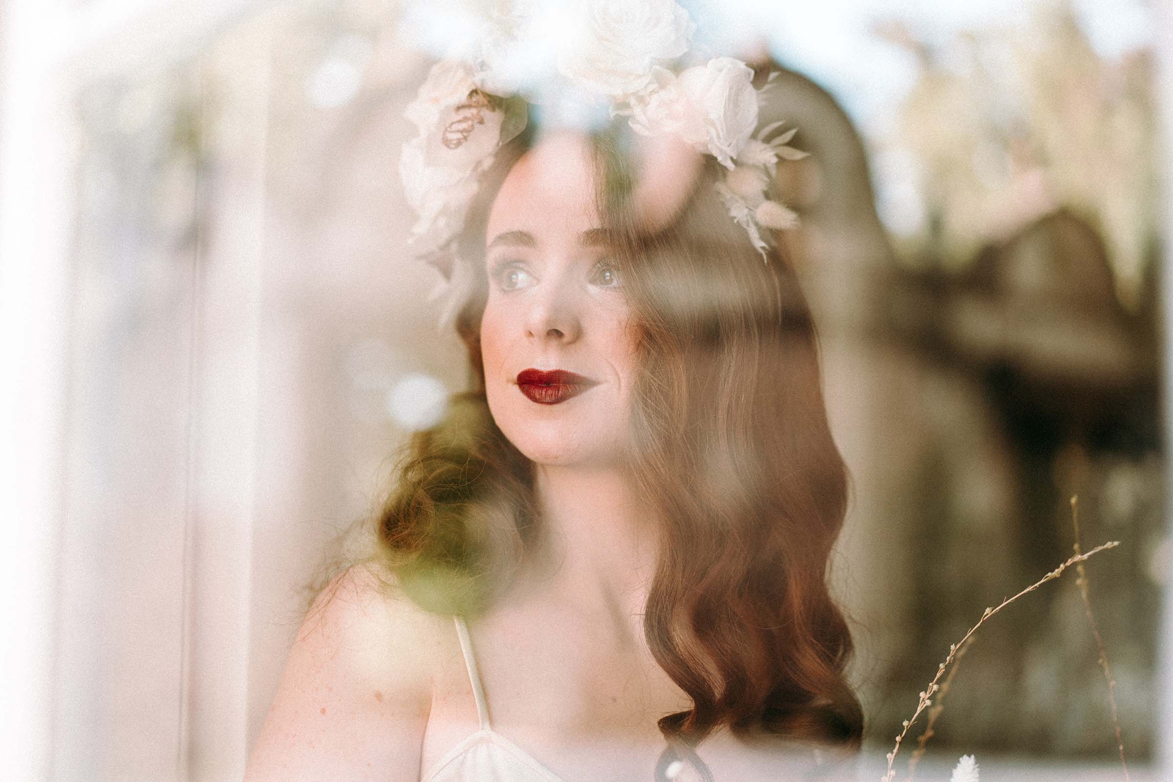 bride red lipstick looking through the window