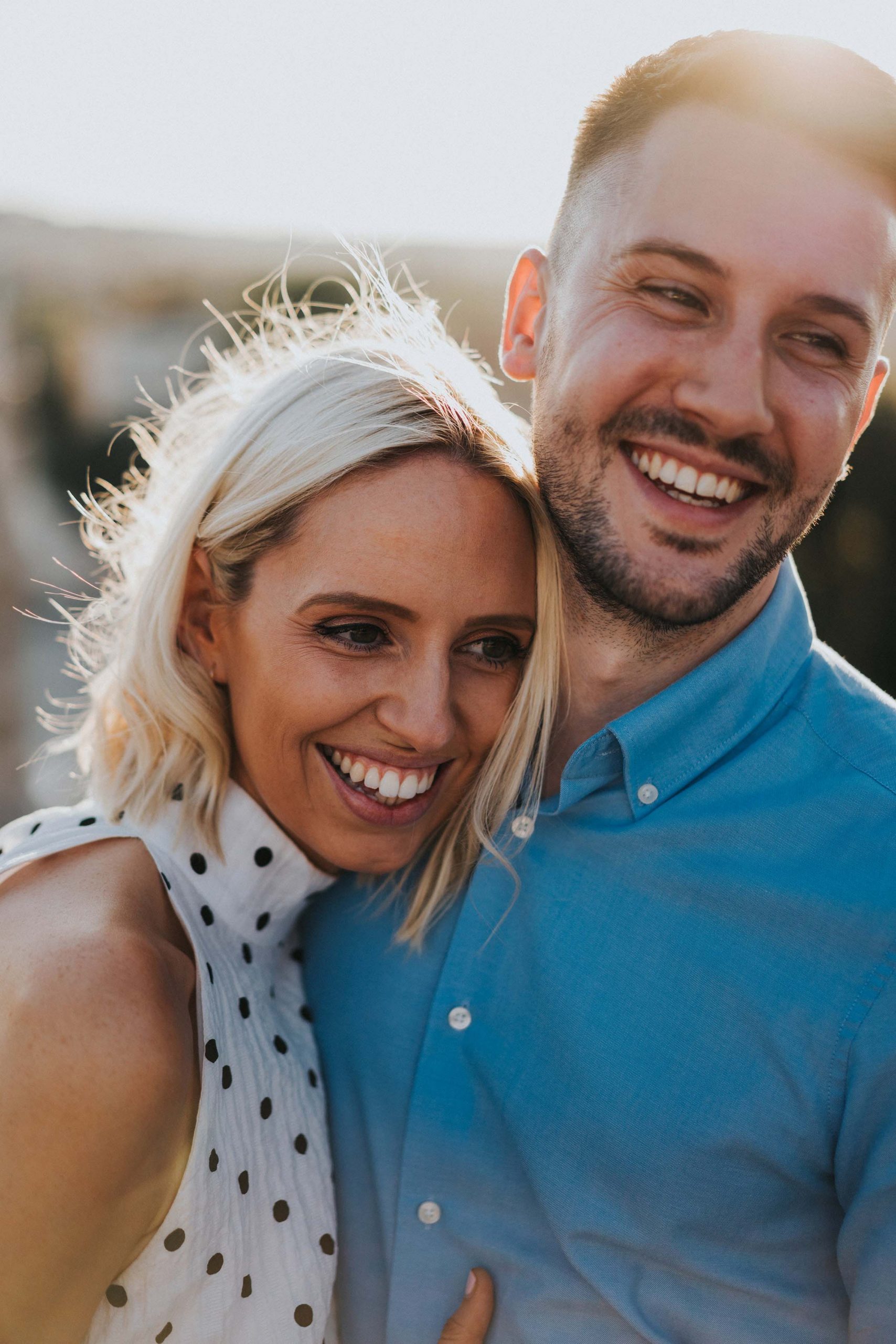 portrait photo couple laughing looking natural