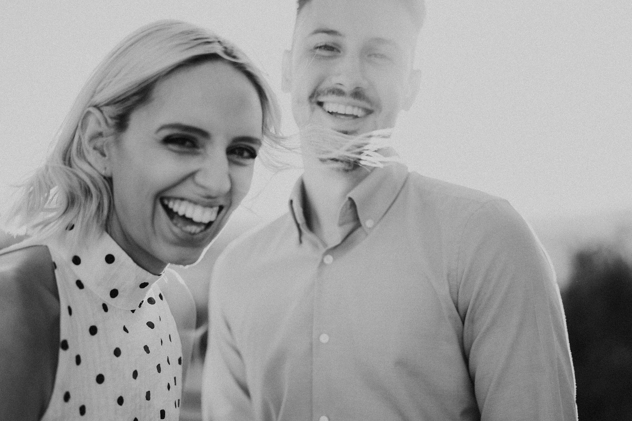 couple laughing in black and white